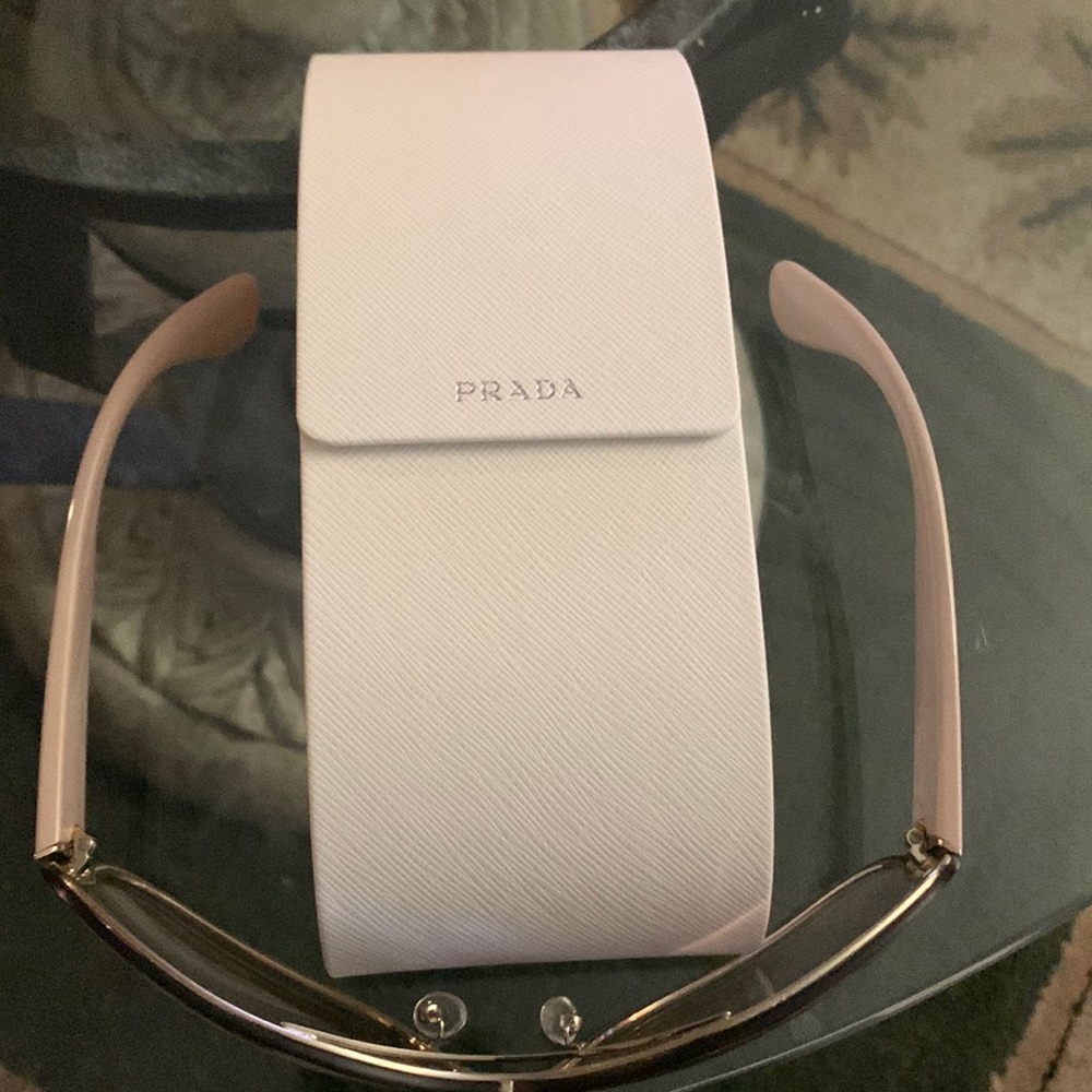 Prada Shades and they have some scratches on them.Prada sell replacement.$60-80.